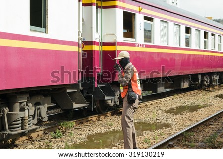 Bangkok, Thailand - September 12, 2015 : Unidentified railway employees controlling the locomotive for switching the railway before serving at State Railway of Thailand.