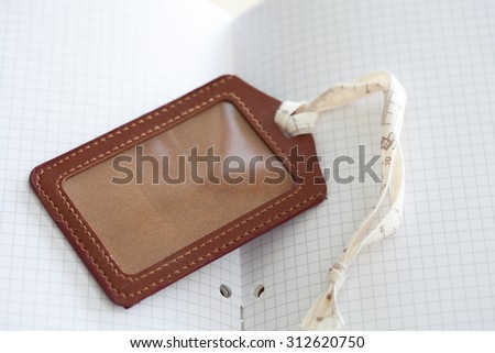 leather luggage tag and notebook for plan journey