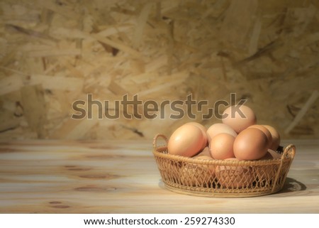 Still life eggs in the basket with soft light and focus. This  eggs so fresh from farm. On the egg shell have dung and mucilage for safe freshness for long time.