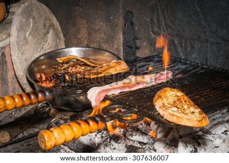 Cooking Bread (italian: Bruschetta) and meat for a good barbecue