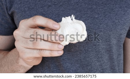 Similar – Image, Stock Photo Male hand holding squashed plastic bottle