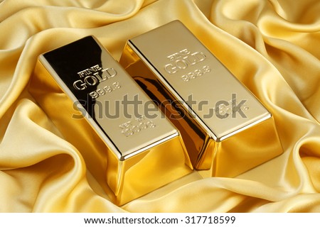 Gold bars on golden silk