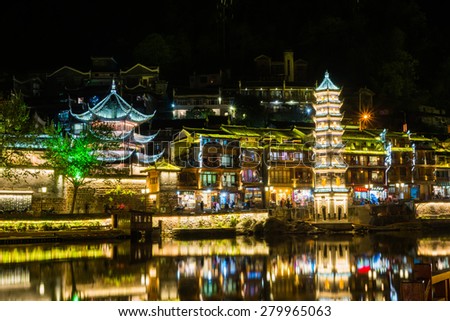 HUNAN, CHINA - APR 12 : Old houses in Fenghuang county on Apr 12, 2015 in Hunan, China. The ancient town of Fenghuang was added to the UNESCO World Heritage Tentative List in the Cultural category.