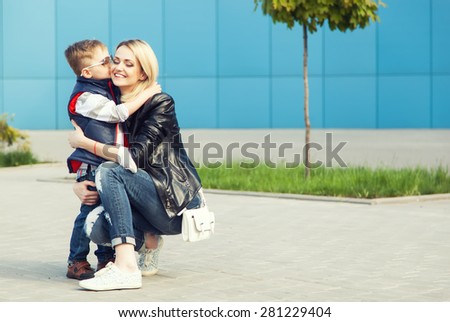 happy family concept. Son kissing his beautiful mother.