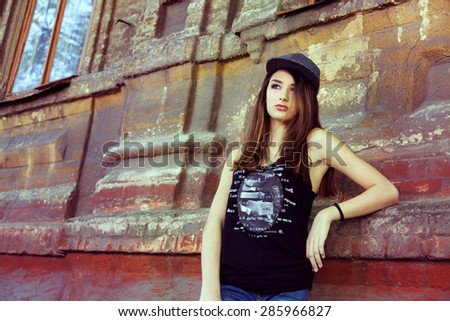 street fashion portrait of young beautiful woman in trendy casual wear.
