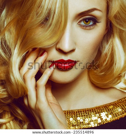 Beautiful Sexy Woman face closeup, makeup with Red Lips and Nails. Beauty blond Girl. Passion. Makeup, Hairdo and Manicure. Sensual Mouth. Sexy Red Color Lips. Gold bakground