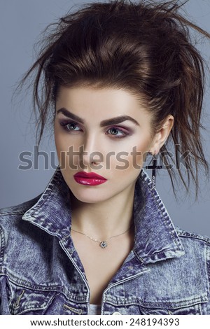 High fashion look. Portrait of a fashionable model with sexy rose lips and perfect skin. Close up. Studio shot