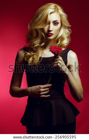 Beautiful Sexy fashion  Woman , makeup with Red Lips, Nails and Rose Flower. Beauty blond Girl. Passion. Makeup, Hairdo and Manicure. Sensual Mouth. Sexy Red Color Lips.