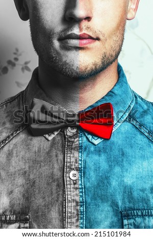Dual male fashion portrait concept. Young and handsome hipster man in blue jeans shirt and red bow-tie over vintage background. Close up. Studio shot. Copy-space.