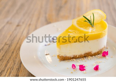 Similar – Image, Stock Photo Cheesecake slice with lemon syrup topping. Slice of cheesecake close-up