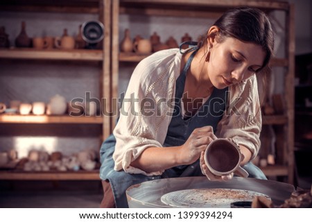 Stylish ceramist master  molding a vase of clay on a potter's wheel. Pottery workshop. Stock fotó © 
