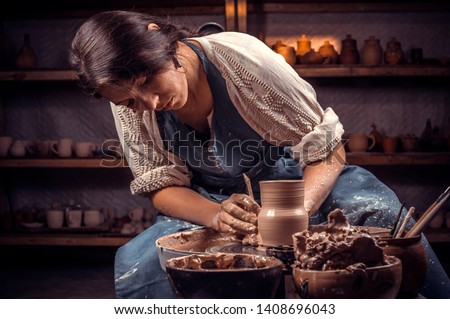 Beautiful handicraftsman master making ceramic pot on the pottery wheel . Handcraft. Stock fotó © 