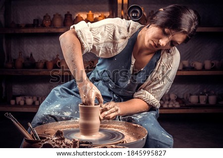 Stylish potter master woman enjoying pottery art and production process. Handicraft. Stock fotó © 