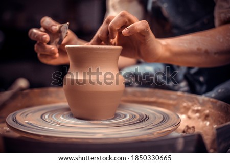Potter's wheel and the hands of an artisan. Close-up. Stock fotó © 