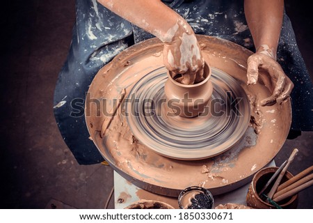 Ceramist master enjoying pottery art and production process. Handicraft. Close-up. Stock fotó © 
