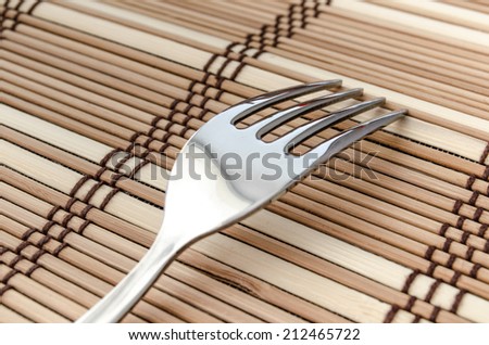 One Silver fork on a napkin