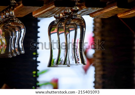 Empty glasses for alcohol beverage above a bar rack background