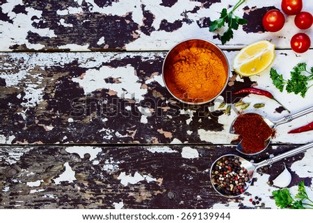 Spices and herbs selection - vintage spoons and old wooden background - cooking, healthy eating. Food concept. Top view.