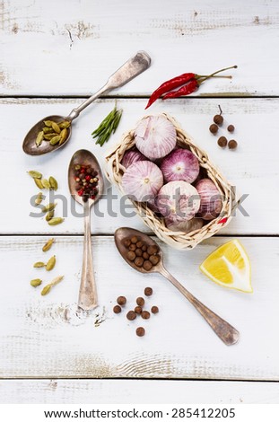 Spices. Herbs and spices selection - old metal spoons and white wooden background. Cooking, food or health concept.