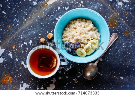 Similar – Image, Stock Photo Hot porridge with frozen blueberries