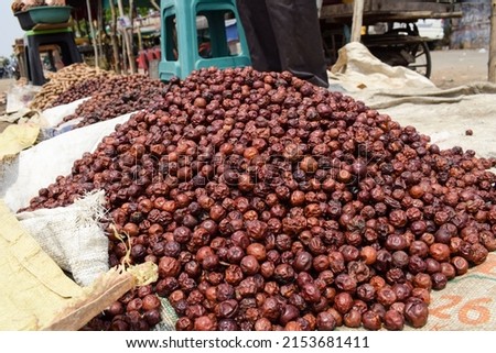 Indian dried jujube jungli Ber sold in Vegetable Sunday market. Bora or Ber wild jungle fruit selling by villagers big heap wholesale market in a Village road side highway market in Maharastra India
 Stock fotó © 