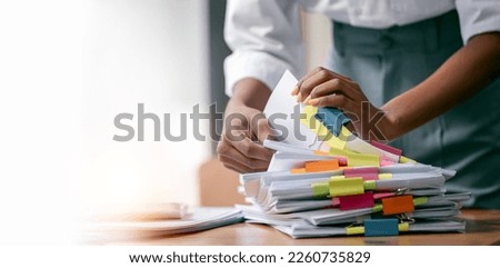 Similar – Image, Stock Photo A messy stack of file folders lies on a desk