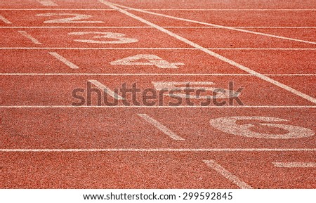 Old running track with numbers for sport background.