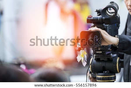 Video camera operator working with his equipment Сток-фото © 
