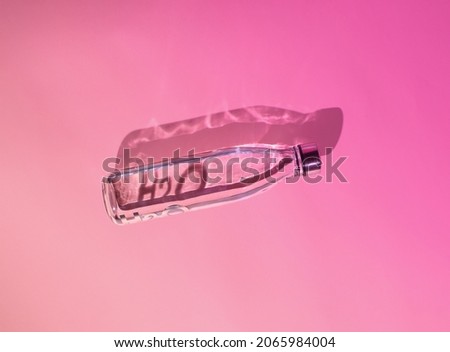 Similar – Image, Stock Photo Water bottle on pink background close-up