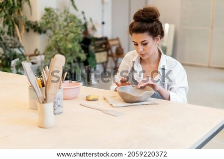 Image, Stock Photo Woman making ceramic work with potter’s wheel