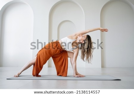 Similar – Image, Stock Photo A young woman leaving the airport with her luggage at her destination