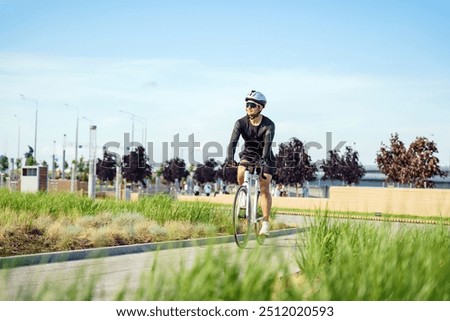 Image, Stock Photo Cyclist rides through image