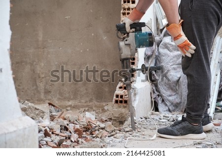 Similar – Image, Stock Photo Unrecognizable handyman using machine on factory