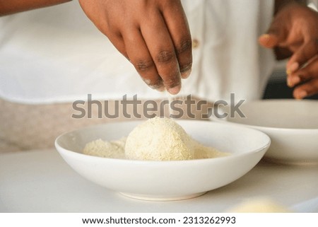 Similar – Image, Stock Photo Faceless woman preparing eggs with whisk in kitchen