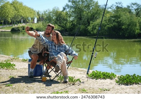 Similar – Image, Stock Photo two fishermen in a boat with reflection in a still river water at twilight on autumn landscape.