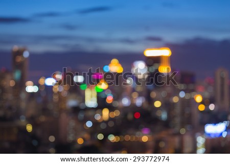 Blurred bokeh city skyline during twilight