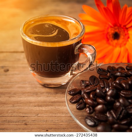 sweet morning with  espresso coffee on wooden table under soft light of sunrise