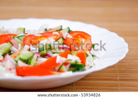 Side dish with green cucumber and red tomato