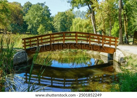 Similar – Foto Bild Eine Brücke aus Holz, die über einen Bach führt