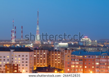 Tyumen, Russia - April 4, 2015: Night view of the TV tower with a height from the street Shirotnaya