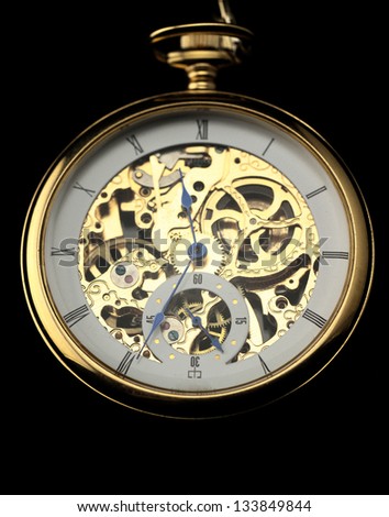 Old watch machine on dark background