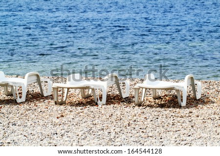 plastic chairs at a beautiful beach (Vis Island)