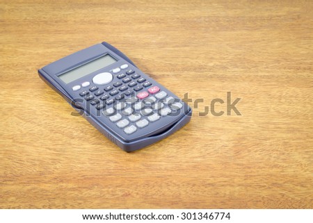science calculator on brown wood desktop