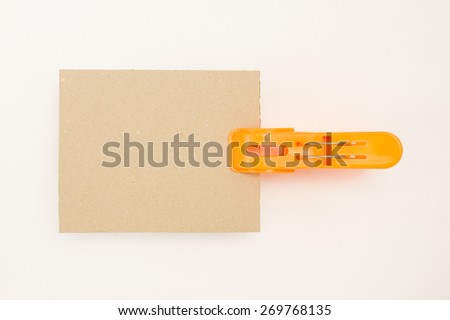 Cardboard with Orange Clothes Pin