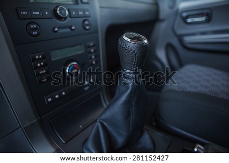 Detail interior of modern auto. Gear shift in car.