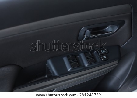 Auto door handle. Car interior detail.
