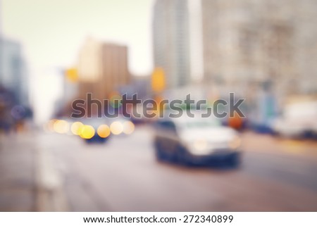 Blurred blurry soft focus background, busy downtown street with cars and lights, urban city life concept