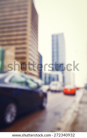 Blurred blurry soft focus background, busy downtown street with cars and lights, urban city life concept