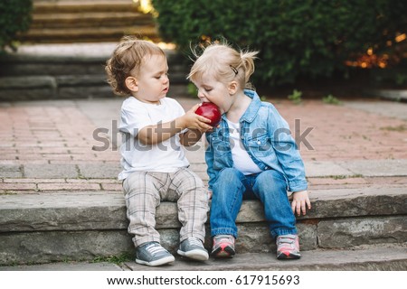 Similar – Image, Stock Photo Cute caucasian little girl with Strelitzia houseplant at home. Greenery in modern apartment. Love and take care of plants, hobby time. Indoor cozy garden.