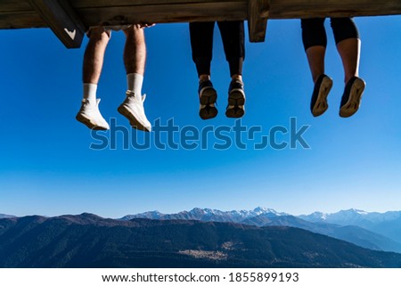 
Three people dangled their legs Foto d'archivio © 